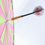 dart in the bullseye of a dartboard