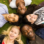 group fo teenagers lying in a circle