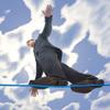 businessman walking on a tightrope