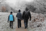 People walking down a winter lane People walking down a winter lane