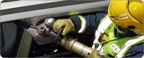 Firefighter using a cutter