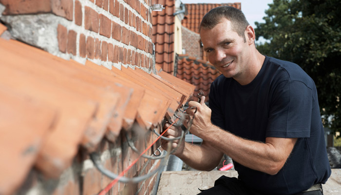 Man fixing gutter