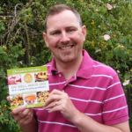 Tim Gannaway with the eat well waste less recipe book