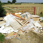 Rubbish dumped in front of gate