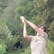 Alex cutting back undergrowth